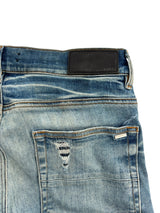 Amiri Staggered Logo Distressed Jeans