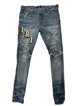 Amiri Distressed Patch Logo Denim Lightwash Cream