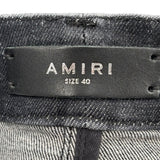 Amiri Staggered Logo Distressed Skinny Jeans